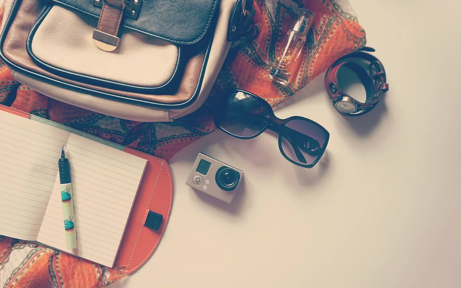 Go pro, pen and notepad